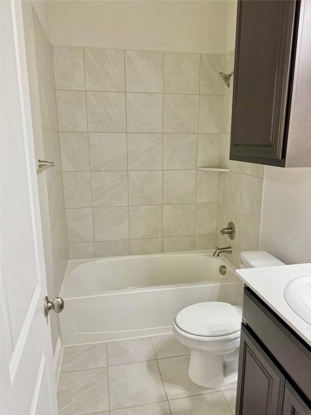 full bathroom with tub / shower combination, vanity, toilet, and tile patterned floors