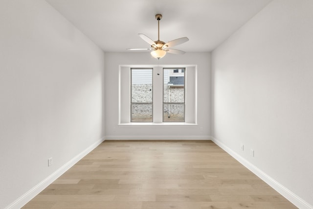 unfurnished room featuring light wood-style floors, ceiling fan, and baseboards