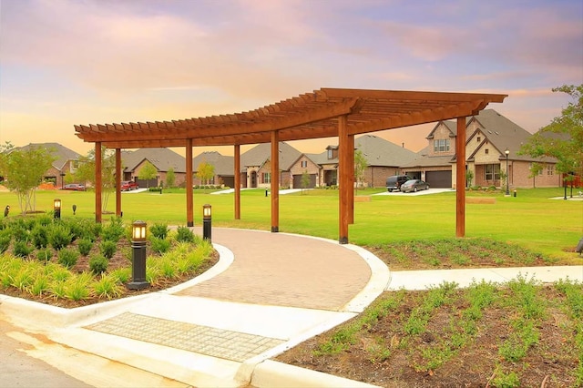 view of community featuring a residential view and a lawn