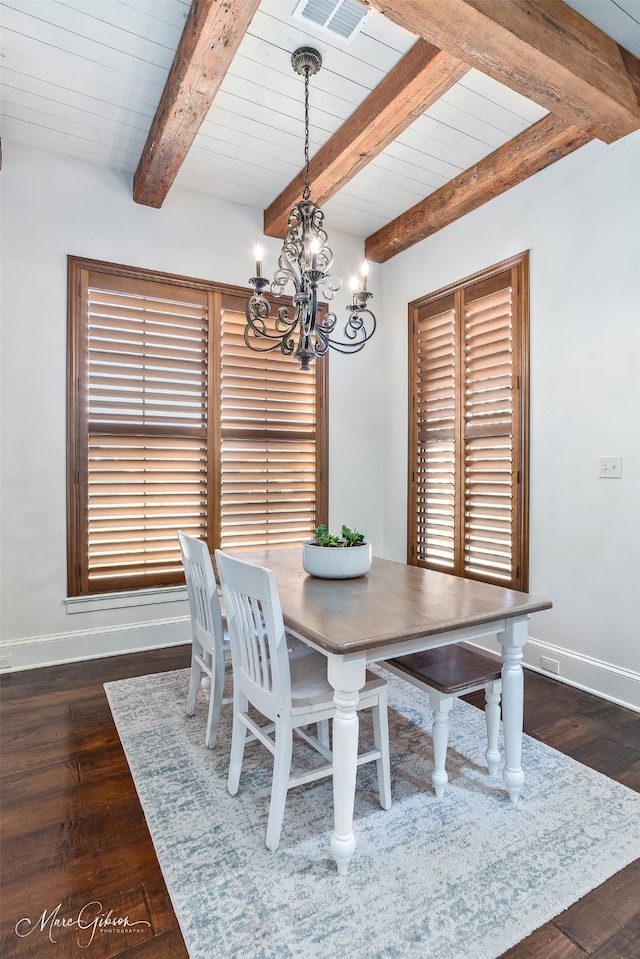 dining space featuring visible vents, baseboards, wood-type flooring, beamed ceiling, and a notable chandelier