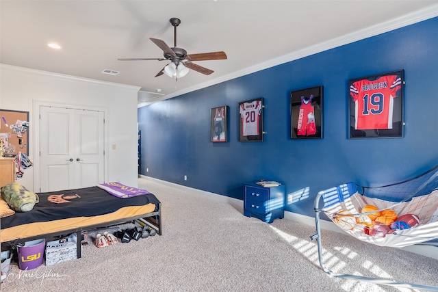 carpeted bedroom with baseboards, visible vents, and ornamental molding