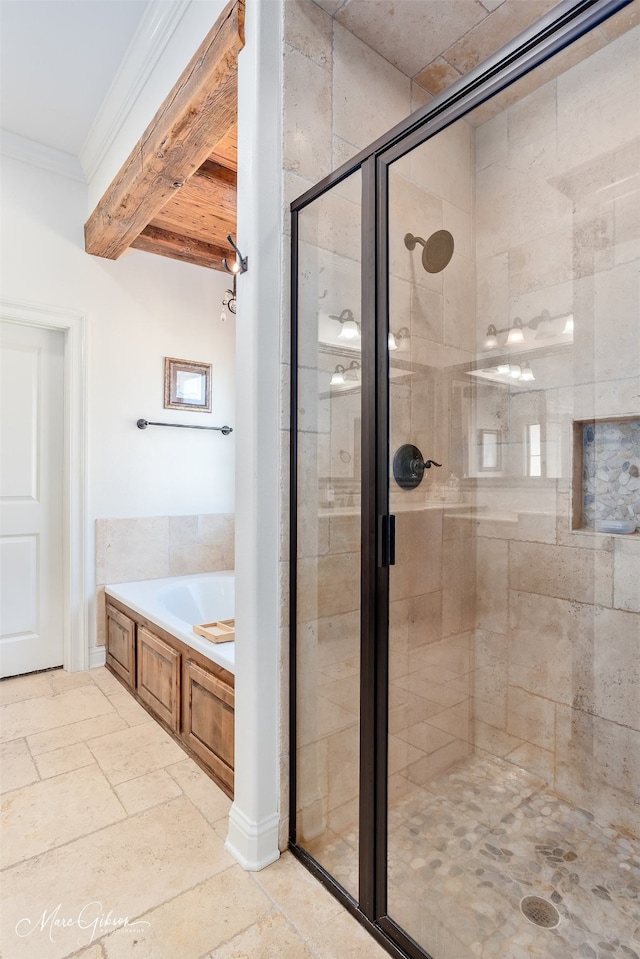 full bathroom featuring crown molding, a garden tub, beam ceiling, a stall shower, and stone tile flooring