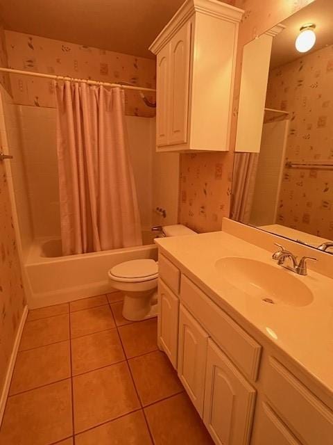 bathroom featuring toilet, wallpapered walls, shower / bath combo with shower curtain, and tile patterned floors