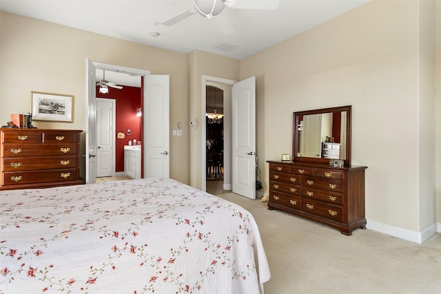 bedroom featuring visible vents, connected bathroom, baseboards, light colored carpet, and ceiling fan