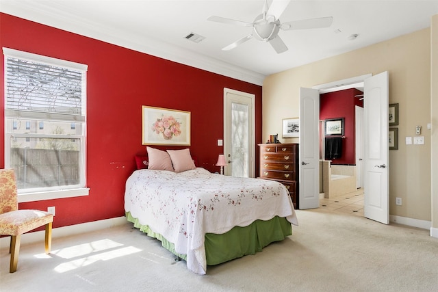 bedroom with multiple windows, baseboards, visible vents, and light carpet