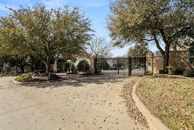 view of gate featuring fence