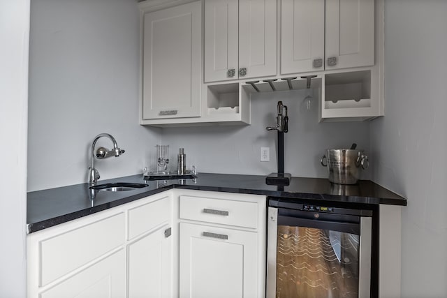 bar featuring wine cooler and a sink