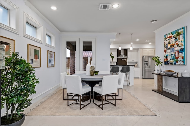 dining room featuring baseboards, ornamental molding, visible vents, and recessed lighting