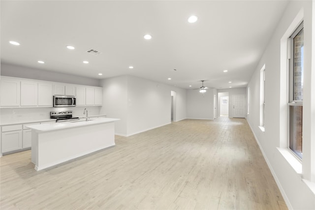 1810 Iris Rd, Melissa, TX 75454 - unfurnished living room with recessed lighting, light wood-type flooring, a ceiling fan, baseboards, and a sink
