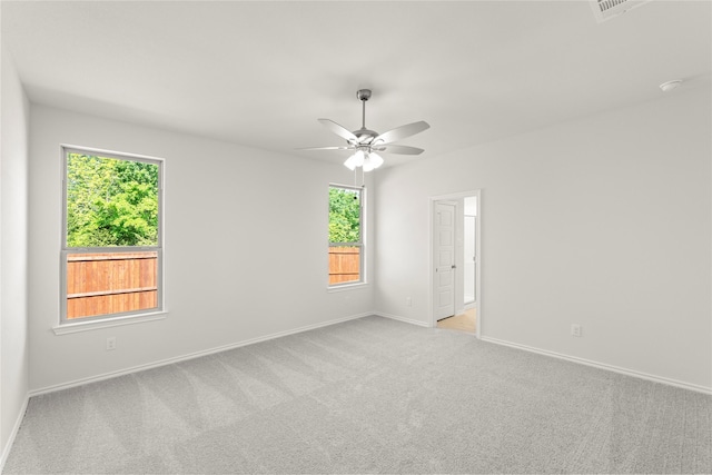 1810 Iris Rd, Melissa, TX 75454 - unfurnished room featuring light carpet, plenty of natural light, a ceiling fan, and baseboards