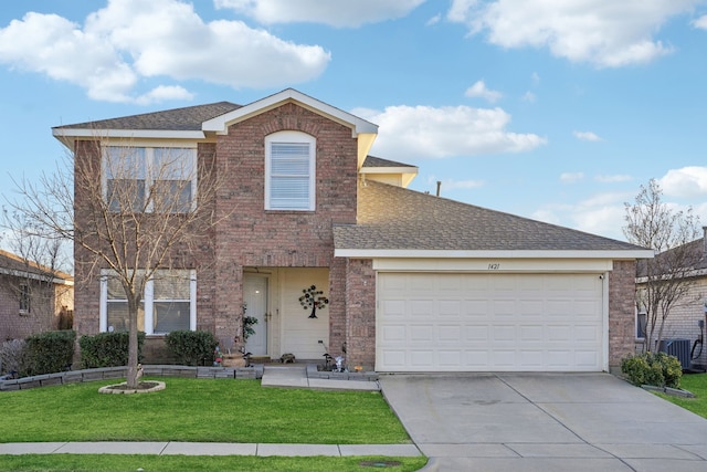 traditional-style house featuring an attached garage, concrete driveway, brick siding, and a front yard