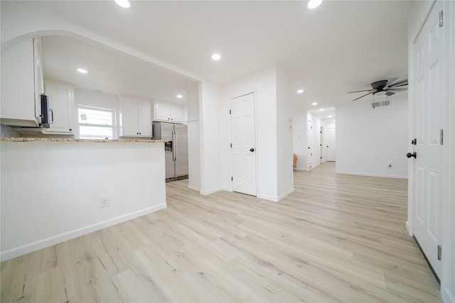 unfurnished living room featuring a ceiling fan, recessed lighting, baseboards, and light wood finished floors