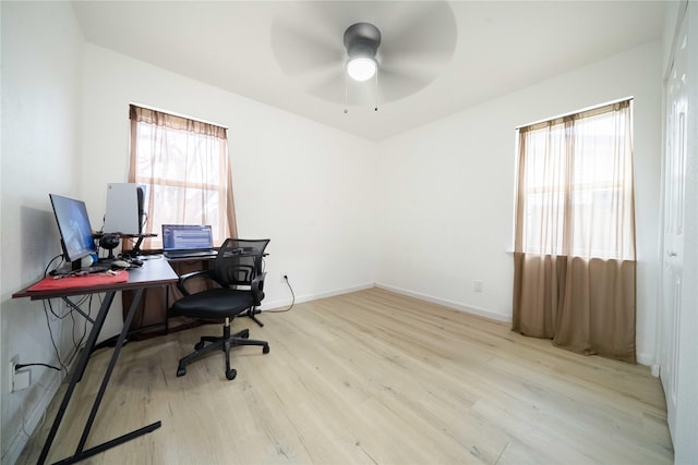 office with light wood-style flooring, baseboards, and ceiling fan