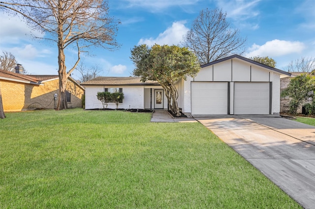 view of front of home featuring driveway, an attached garage, a front lawn, and brick siding