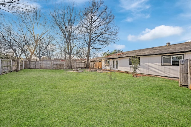 view of yard with a fenced backyard