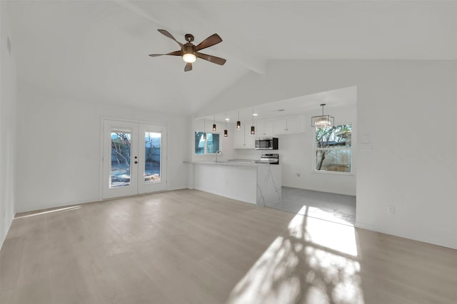 unfurnished living room with french doors, light wood-type flooring, a sink, and a ceiling fan