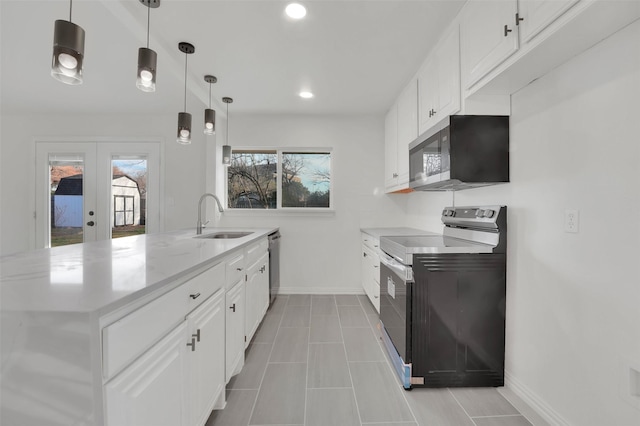 kitchen featuring a sink, white cabinetry, hanging light fixtures, french doors, and appliances with stainless steel finishes