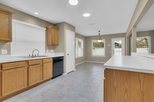 kitchen featuring dishwasher, baseboards, a sink, and light countertops