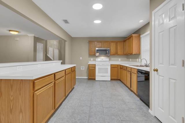 kitchen with a sink, stainless steel microwave, visible vents, white electric range, and dishwasher