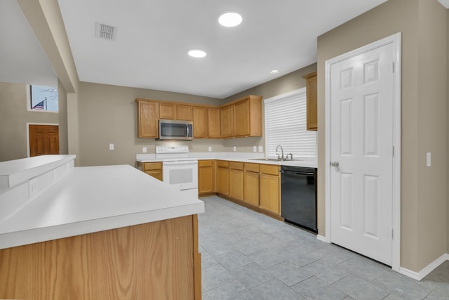 kitchen featuring white electric range, light countertops, dishwasher, a sink, and stainless steel microwave