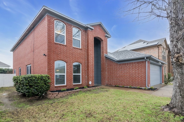 view of front of property featuring a garage, brick siding, a shingled roof, fence, and a front lawn