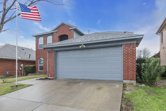 view of front of property with driveway, brick siding, an attached garage, and a shingled roof