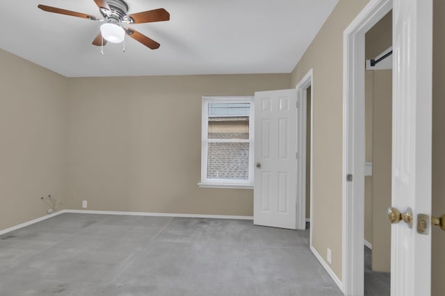 unfurnished bedroom featuring baseboards and ceiling fan