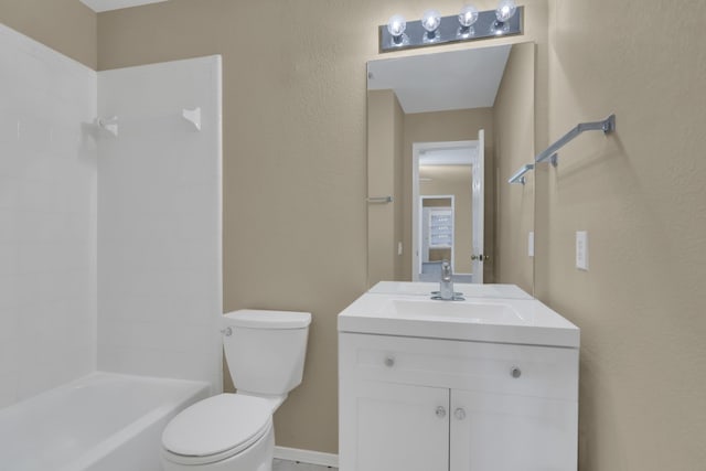 bathroom with shower / washtub combination, baseboards, vanity, and toilet