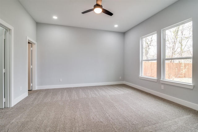 unfurnished room featuring carpet floors, recessed lighting, and baseboards