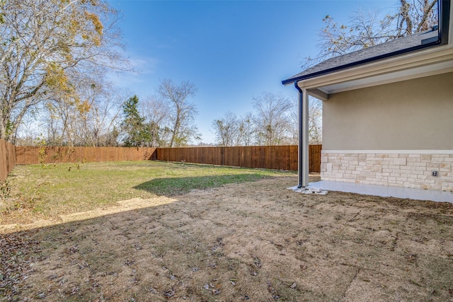 view of yard featuring a fenced backyard