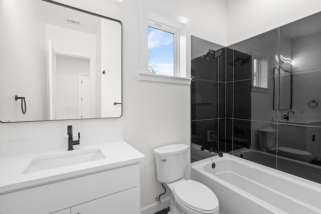 bathroom featuring visible vents,  shower combination, vanity, and toilet