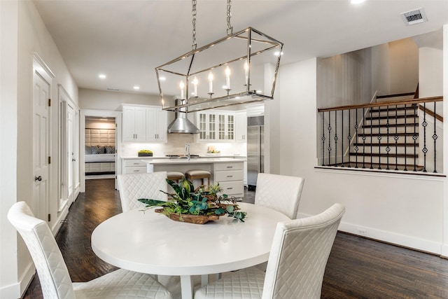 dining room with baseboards, visible vents, dark wood-type flooring, stairs, and recessed lighting