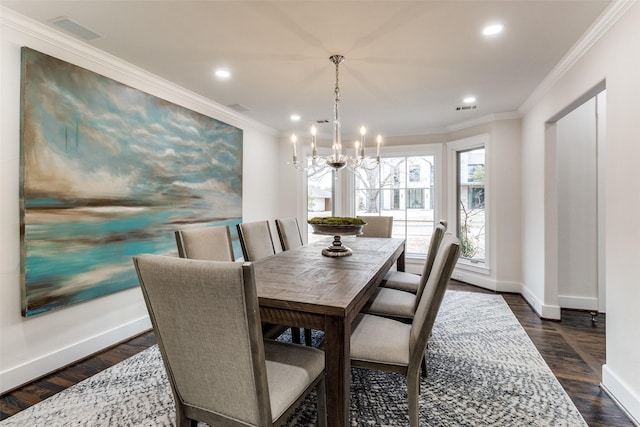 dining space featuring ornamental molding, visible vents, dark wood finished floors, and baseboards