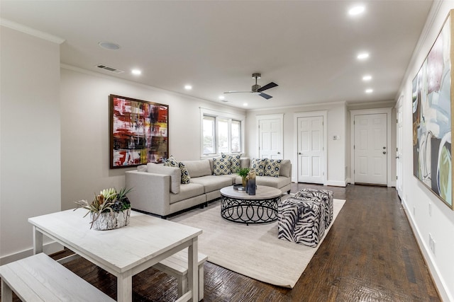 living area with recessed lighting, visible vents, baseboards, dark wood finished floors, and crown molding