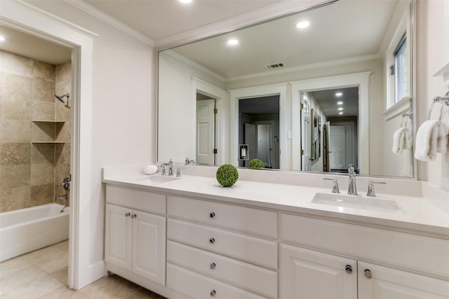 full bathroom with double vanity, crown molding, visible vents, and a sink