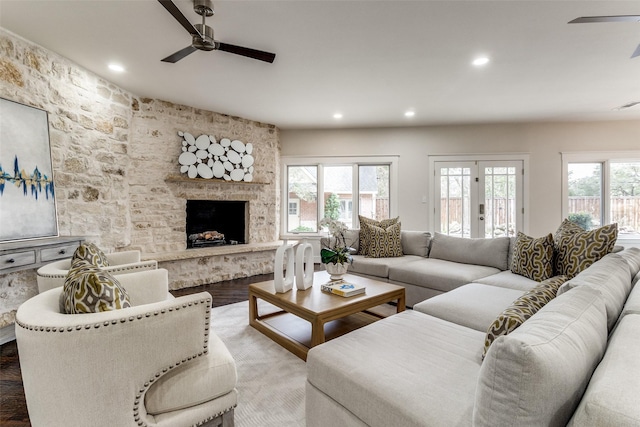 living room with visible vents, ceiling fan, wood finished floors, a fireplace, and recessed lighting