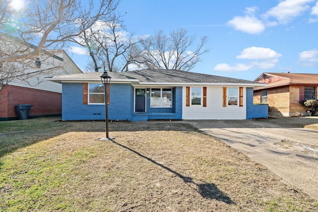 ranch-style home with driveway, a front yard, and brick siding