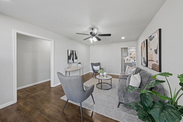 living room featuring ceiling fan, recessed lighting, dark wood finished floors, and baseboards