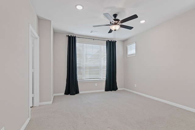 unfurnished room with visible vents, baseboards, a ceiling fan, carpet, and recessed lighting