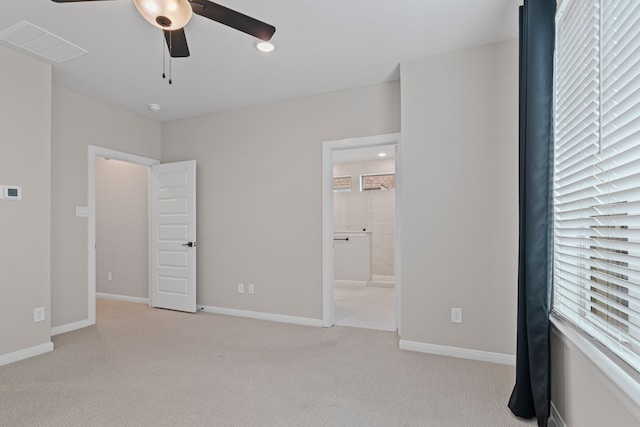 unfurnished bedroom with light carpet, baseboards, visible vents, connected bathroom, and recessed lighting