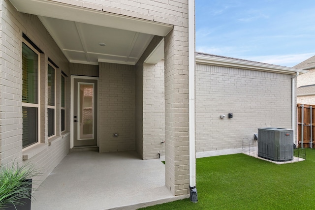 view of patio / terrace with fence and central air condition unit