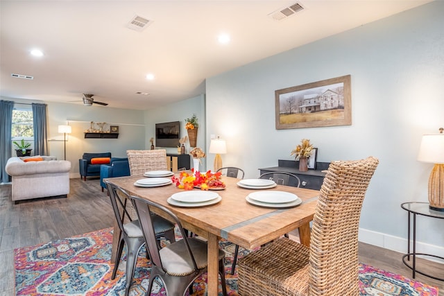 dining room with dark wood-type flooring, recessed lighting, visible vents, and baseboards