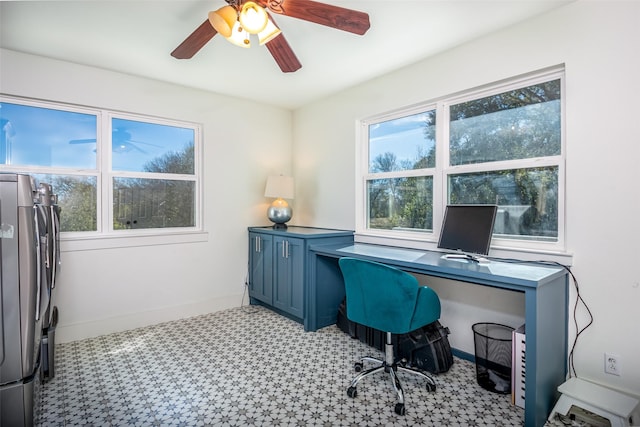 office area with light floors, ceiling fan, and baseboards