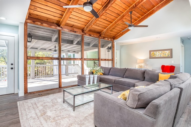 living area with a ceiling fan, wood ceiling, lofted ceiling with beams, and wood finished floors