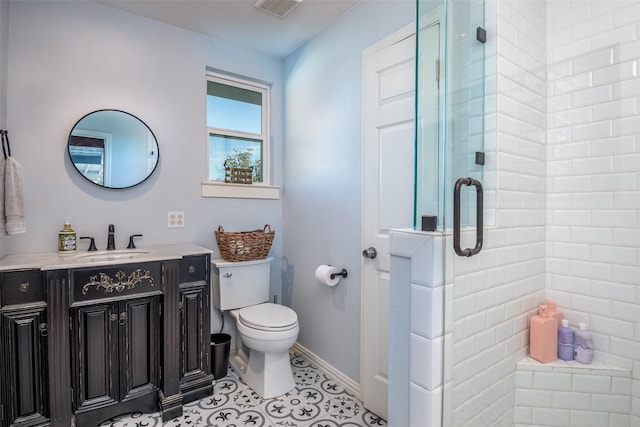 full bathroom featuring tile patterned flooring, toilet, visible vents, vanity, and a shower stall