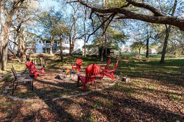 view of yard with a fire pit