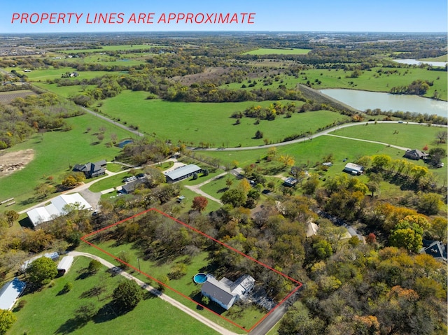 aerial view featuring a rural view and a water view