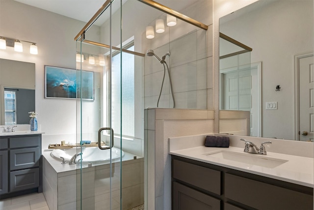 full bathroom featuring a wealth of natural light, a shower stall, and a sink