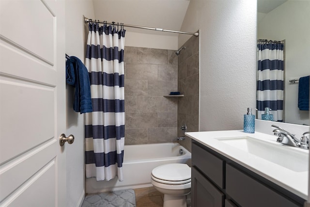 full bath featuring a textured wall, toilet, shower / bathtub combination with curtain, and vanity