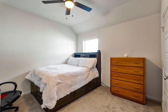 bedroom with lofted ceiling, ceiling fan, light carpet, and baseboards